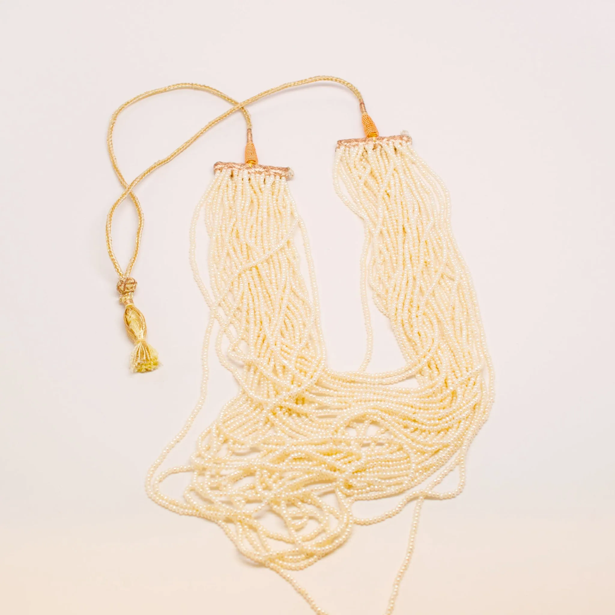 Indian multi strand natural seed pearl Necklace With Gold Wovern Cord